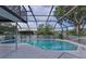 Relaxing screened-in pool area with a clear blue pool and outdoor lounging space at 36535 Eagle Dr, Grand Island, FL 32735