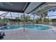 Sparkling screened-in pool with an expansive deck, perfect for outdoor entertaining at 36535 Eagle Dr, Grand Island, FL 32735