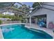 Sparkling screened-in pool with an expansive deck, perfect for outdoor entertaining at 36535 Eagle Dr, Grand Island, FL 32735