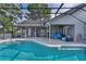 Sparkling screened-in pool with an expansive deck, perfect for outdoor entertaining at 36535 Eagle Dr, Grand Island, FL 32735