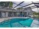 Sparkling pool inside a screened lanai with plenty of space for relaxing and entertaining at 36535 Eagle Dr, Grand Island, FL 32735