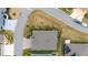 Birds eye view of manicured lawn, mature landscaping, and a private driveway with walkway at 3769 Causey Ct, The Villages, FL 32163