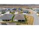 Aerial view showcasing homes with screened lanais, attractive landscaping, and convenient street access at 3769 Causey Ct, The Villages, FL 32163