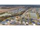 Wide aerial shot of a residential neighborhood featuring lush landscaping and community ponds at 3769 Causey Ct, The Villages, FL 32163