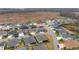Aerial shot of a neatly arranged neighborhood featuring sidewalks, diverse home styles, and well-kept lawns at 3769 Causey Ct, The Villages, FL 32163