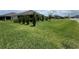 Spacious backyard with a lush green lawn and trees at 3769 Causey Ct, The Villages, FL 32163