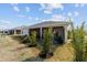 Well maintained backyard with privacy landscaping and screened in porch at 3769 Causey Ct, The Villages, FL 32163