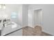 Bright bathroom features double vanity with granite counters and private toilet at 3769 Causey Ct, The Villages, FL 32163