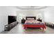 Spacious bedroom offers neutral walls, ceiling fan, and wood-look tile flooring at 3769 Causey Ct, The Villages, FL 32163