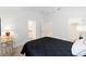 This bedroom has an ensuite bath, ceiling fan, and a walk-in closet, offering comfort and convenience at 3769 Causey Ct, The Villages, FL 32163