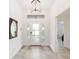 Inviting foyer with tiled floors and an overhead light fixture at 3769 Causey Ct, The Villages, FL 32163