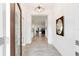 Bright foyer featuring tile flooring and an open view to the living spaces at 3769 Causey Ct, The Villages, FL 32163