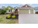 Inviting single-story home with a two-car garage and lush landscaping at 3769 Causey Ct, The Villages, FL 32163