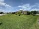 Well-maintained front yard with lush green lawn, trees and shrubs at 3769 Causey Ct, The Villages, FL 32163