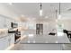 Well-lit kitchen features stainless steel appliances, light countertops, and ample cabinet space at 3769 Causey Ct, The Villages, FL 32163