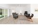 Open living space featuring tiled floors and a sliding glass door to the lanai at 3769 Causey Ct, The Villages, FL 32163