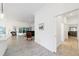Open-concept living area with tiled flooring and access to outdoor space at 3769 Causey Ct, The Villages, FL 32163