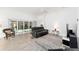 Bright living room featuring tile flooring and a sliding glass door leading to the lanai at 3769 Causey Ct, The Villages, FL 32163