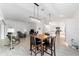 Open-concept living space with sightlines to kitchen, dining, and living areas promoting easy entertaining at 3769 Causey Ct, The Villages, FL 32163