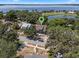 Aerial view of a home near a lake, featuring lush greenery and beautiful surroundings at 378 W Osceola St, Clermont, FL 34711