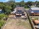 Aerial view of home with a spacious backyard and outdoor living spaces at 378 W Osceola St, Clermont, FL 34711