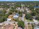 Aerial view showcasing the house, neighborhood streets, and nearby water features at 378 W Osceola St, Clermont, FL 34711