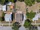 Aerial view of residential neighborhood with fenced yards and mature trees at 378 W Osceola St, Clermont, FL 34711