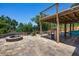 Backyard with patio, fire pit, playhouse, and water views at 378 W Osceola St, Clermont, FL 34711