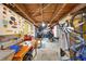 Basement workshop area with exposed wooden ceiling and wall stickers at 378 W Osceola St, Clermont, FL 34711