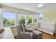 Bright Bedroom featuring natural light, crib, rocking chair, and hardwood floors at 378 W Osceola St, Clermont, FL 34711