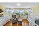 Bright Bedroom featuring natural light, crib, rocking chair, and hardwood floors at 378 W Osceola St, Clermont, FL 34711