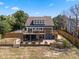 Exterior view of home with deck, patio, and well-manicured landscaping at 378 W Osceola St, Clermont, FL 34711