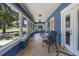 Inviting front porch with ample seating and views of the neighborhood at 378 W Osceola St, Clermont, FL 34711