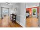 Hallway featuring hardwood floors, with a view into the bedroom and bonus room at 378 W Osceola St, Clermont, FL 34711