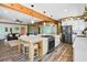 Open kitchen design with an island, cooktop, modern appliances, and connects to the living area at 378 W Osceola St, Clermont, FL 34711