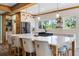 Modern kitchen featuring an island with barstool seating, stainless steel appliances, and ample lighting at 378 W Osceola St, Clermont, FL 34711