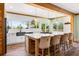 Bright and airy kitchen with an island, pendant lighting, stainless steel appliances, and outdoor view at 378 W Osceola St, Clermont, FL 34711