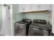 Convenient laundry room area with washer, dryer, and storage cabinets at 378 W Osceola St, Clermont, FL 34711