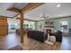 Open-concept living area with a fireplace, hardwood floors, and seamlessly connects to the kitchen at 378 W Osceola St, Clermont, FL 34711