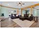 Spacious living room with hardwood floors, wood beam accents, and comfortable leather seating at 378 W Osceola St, Clermont, FL 34711