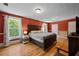 Spacious main bedroom with hardwood floors, large windows, and ample closet space at 378 W Osceola St, Clermont, FL 34711