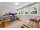 Bright home office with multiple monitors, hardwood floors, and natural light at 378 W Osceola St, Clermont, FL 34711