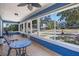 Enclosed porch with blue accents, tile floors, and lots of natural light at 378 W Osceola St, Clermont, FL 34711