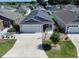 Aerial view of home showing the yard, landscaping, and surrounding neighborhood at 3817 Miragalia Ln, The Villages, FL 32163