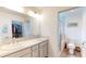 Bright bathroom features double sinks, a walk-in closet, and a separate toilet/shower area at 3817 Miragalia Ln, The Villages, FL 32163