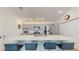 Updated kitchen featuring an island with seating, stainless appliances, and ample storage at 3817 Miragalia Ln, The Villages, FL 32163