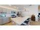 Well-lit kitchen with a large island and stainless steel appliances at 3817 Miragalia Ln, The Villages, FL 32163