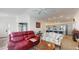 Inviting living room with a breakfast bar, perfect for Gathering gatherings at 3817 Miragalia Ln, The Villages, FL 32163