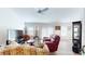 Spacious living room with abundant natural light, hardwood floors, and modern furnishings at 3817 Miragalia Ln, The Villages, FL 32163
