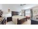 Main bedroom features a large bed, ceiling fan, and coordinated furnishings at 3817 Miragalia Ln, The Villages, FL 32163